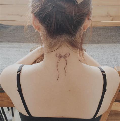 neck bow tattoo